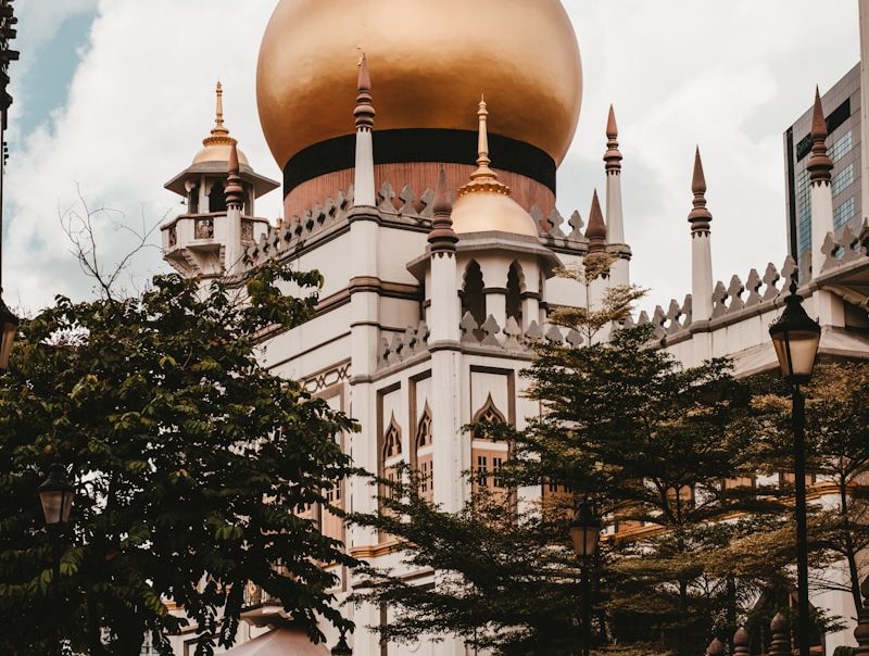 a large white building with a gold dome