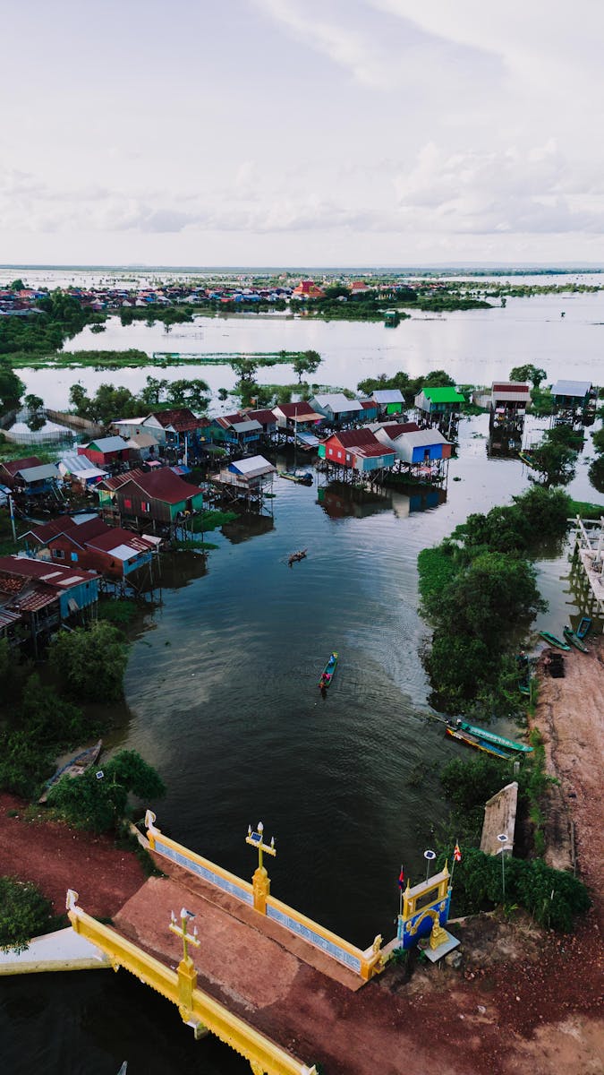 Explore Kampong Khleang, a vibrant village on stilts, captured during the flood season in Siem Reap, Cambodia.