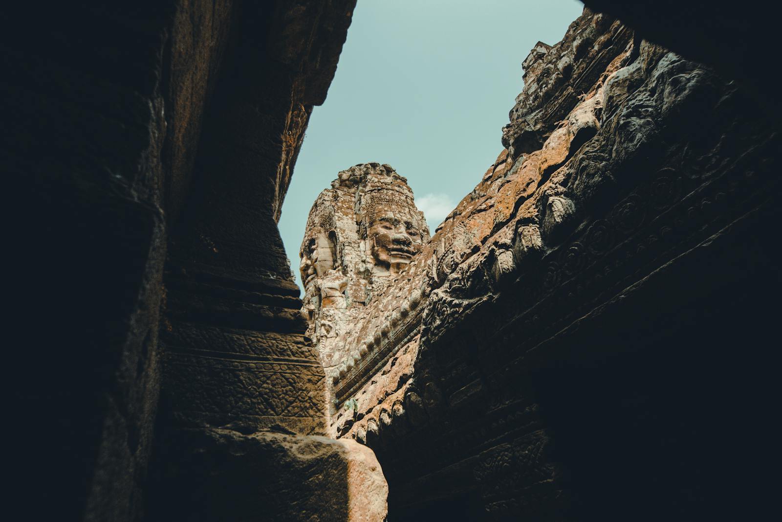 Stunning view of Angkor Wat's ancient stone architecture captured in daylight, showcasing exquisite details.