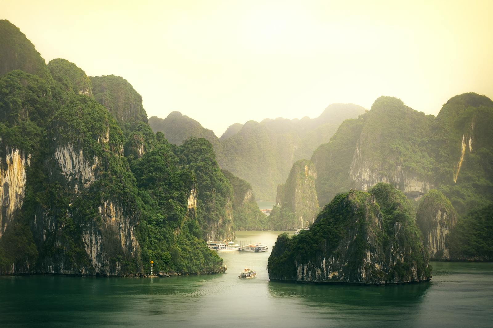Explore the tranquil beauty of Ha Long Bay's limestone formations in Vietnam.