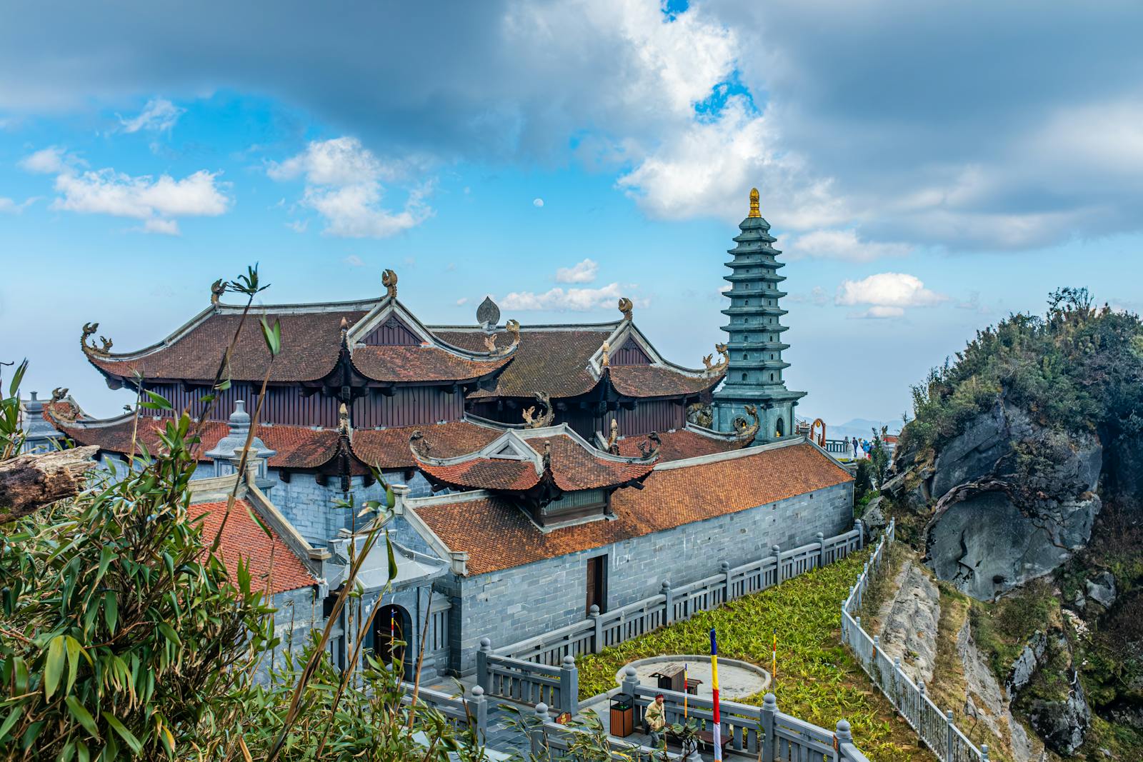Explore the majestic architecture of a Buddhist temple nestled in Vietnam's serene mountains.