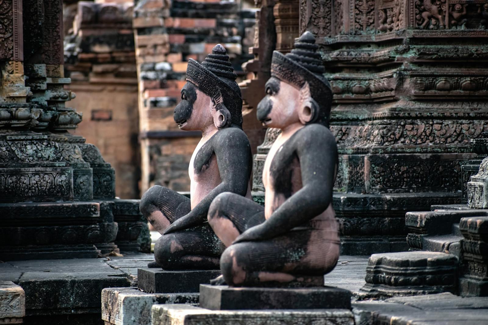Intricate sandstone sculptures in a historic temple complex in Siem Reap, Cambodia.