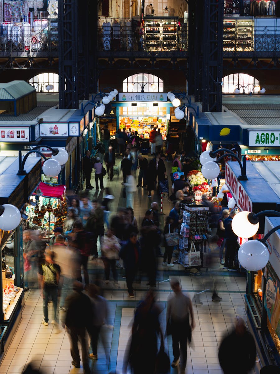 Busy shoppers and vendors inside Budapest's iconic Central Market Hall.