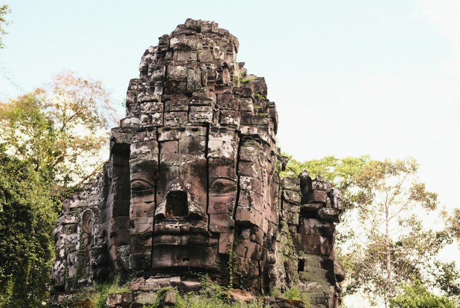 a large stone structure with a face on top of it