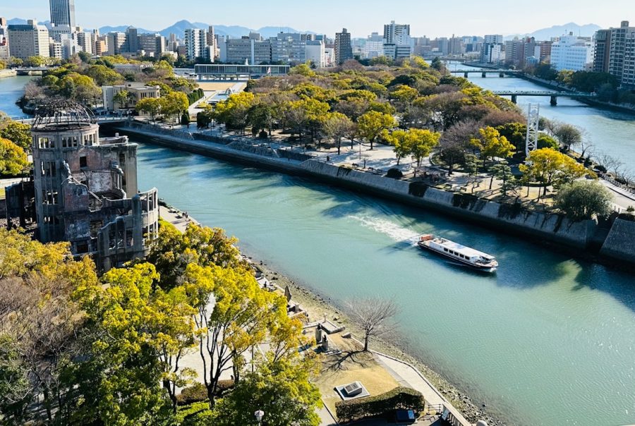 a river running through a city next to tall buildings