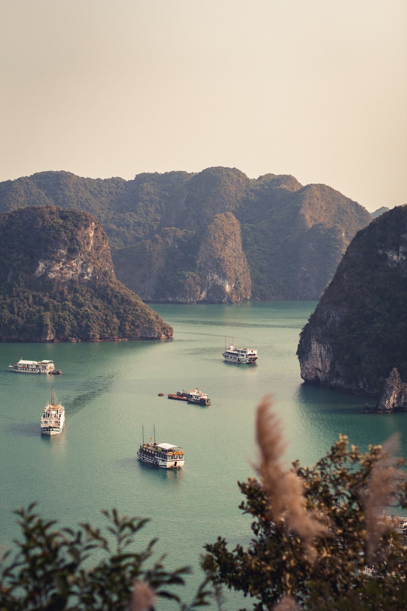 a group of boats floating on top of a large body of water