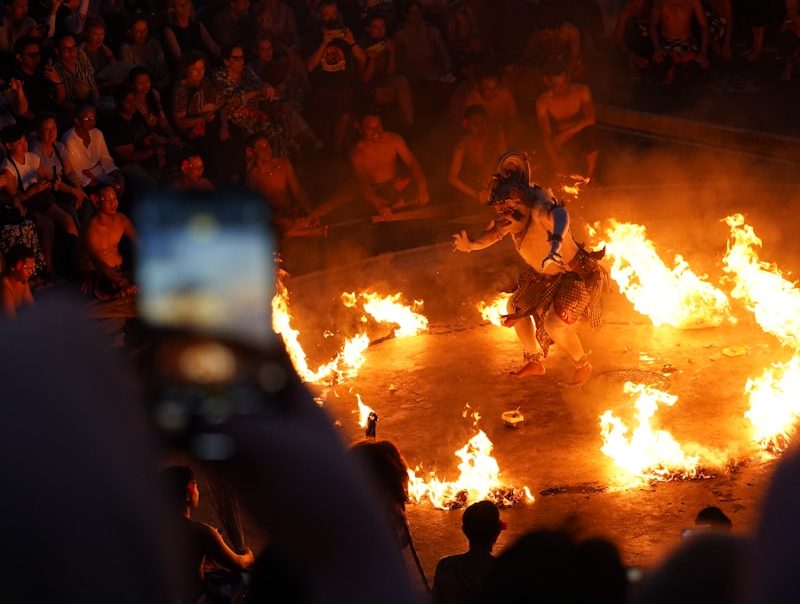 A fire dance performance is taking place.