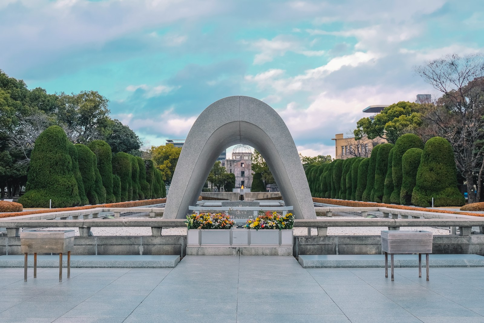 a large monument with benches in front of it